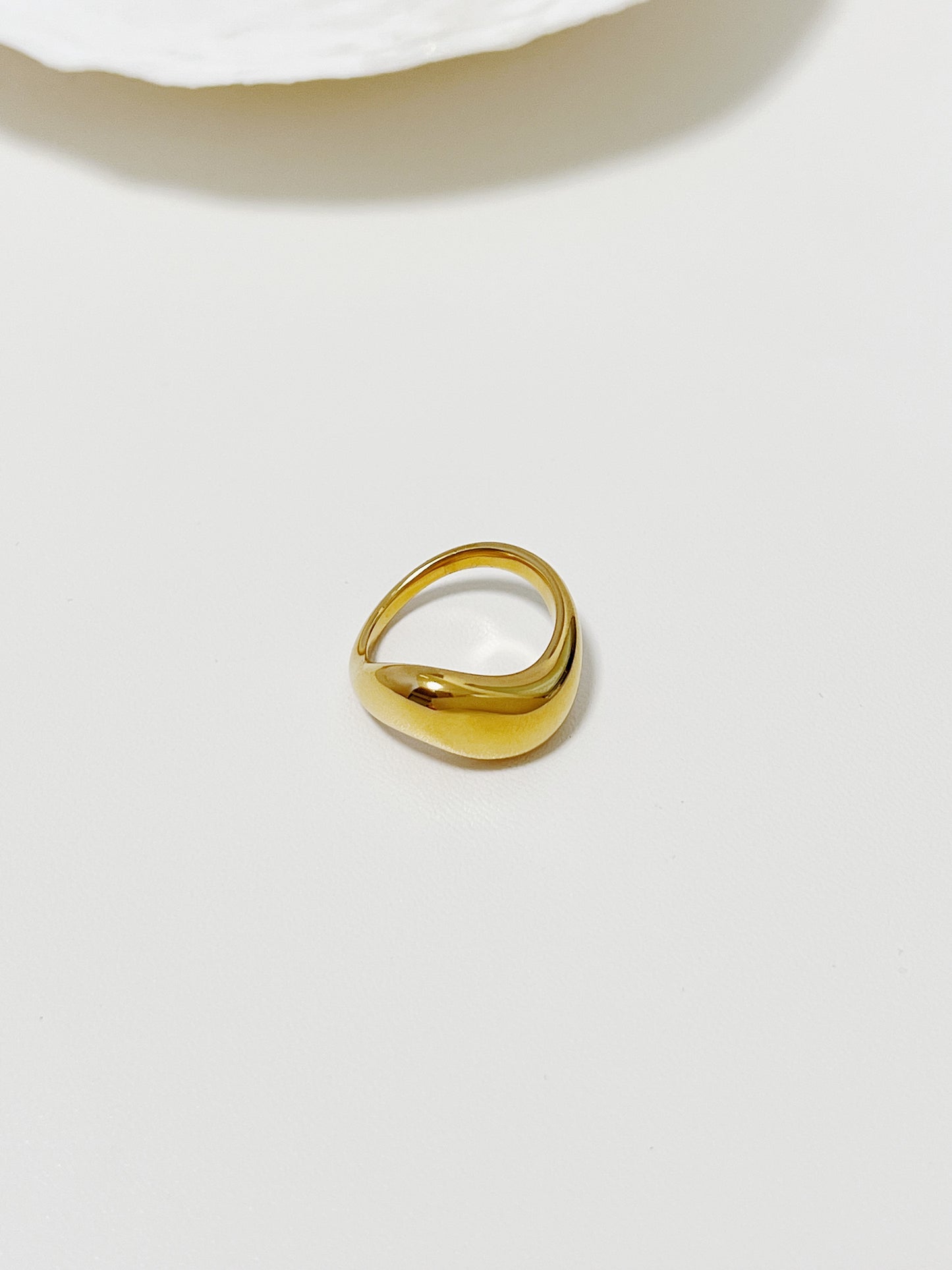 Chunky gold rings for women highlighting the continuous undulating finish
