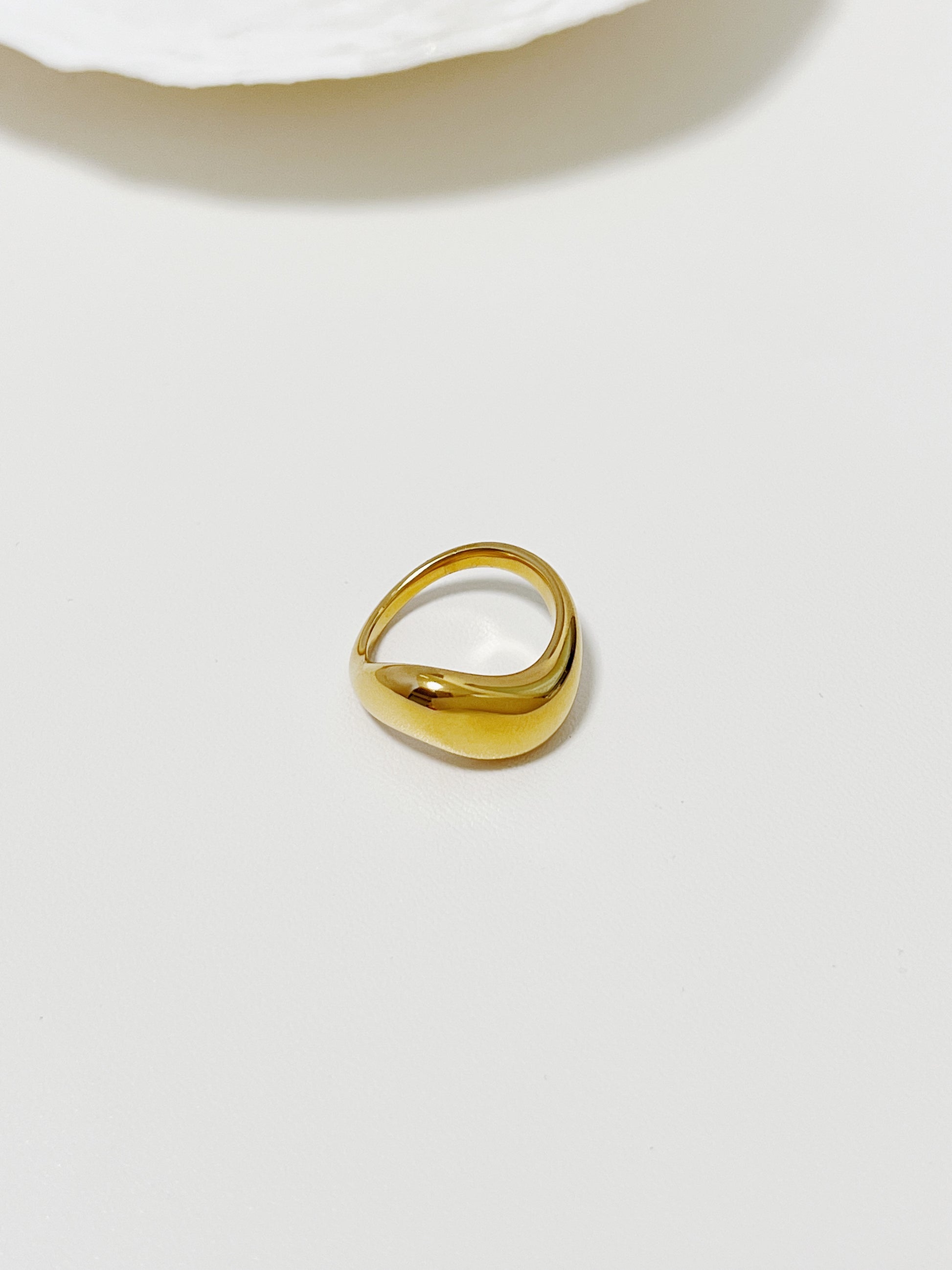 Chunky gold rings for women highlighting the continuous undulating finish