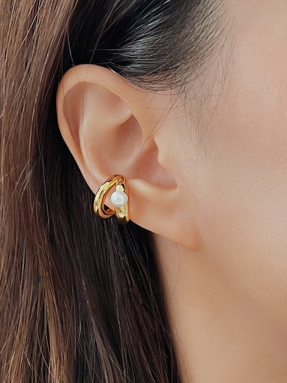 Model wearing the Dior Pearl Double Cuff on the mid-cartilage for a sophisticated, classic look.