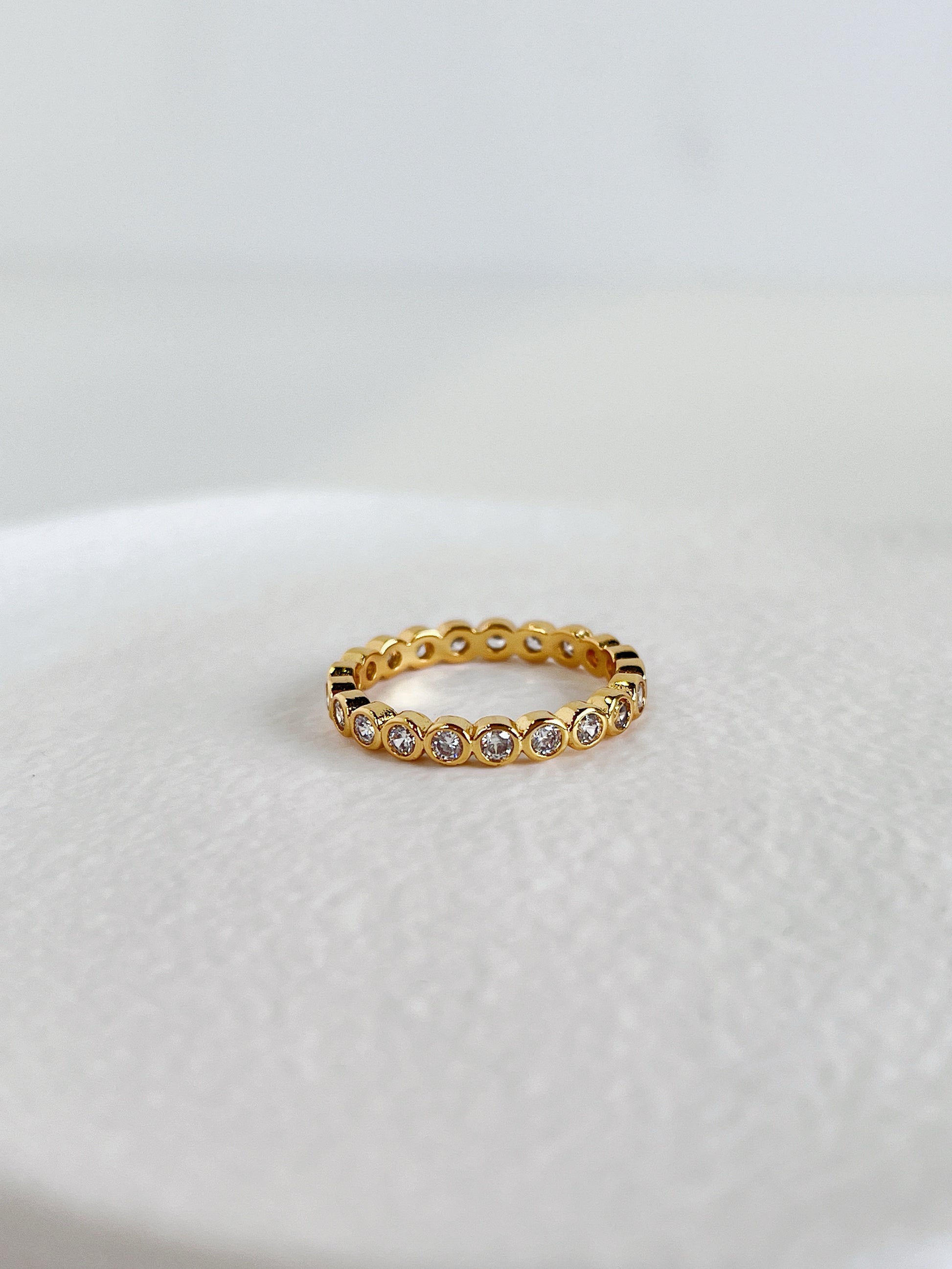 Waterproof non tarnishing gold bezel ring by Aurous Atelier