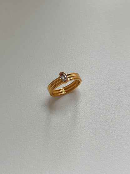 Gold ribbed statement band with 5A grade cubic zirconia oval stone