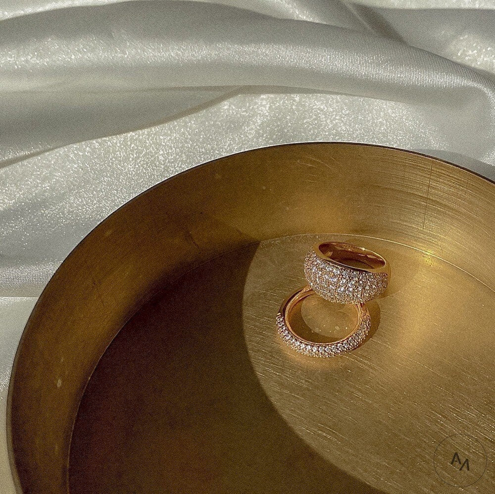 Thick and slim gold pave rings stacked together with 5A CZ