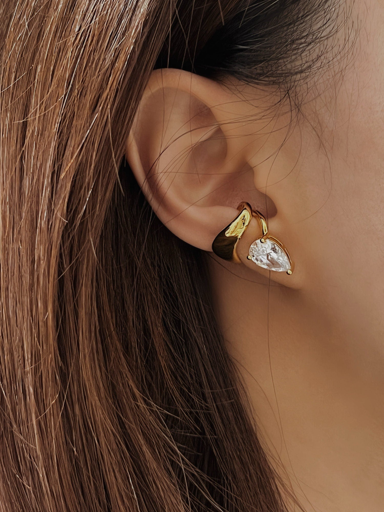 Model wearing Laura tear drop cuff, ear stack