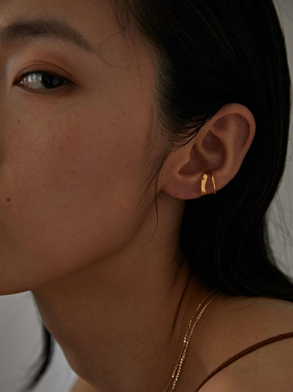 Fashion model wearing the Beverly cuff as a standalone architectural statement.