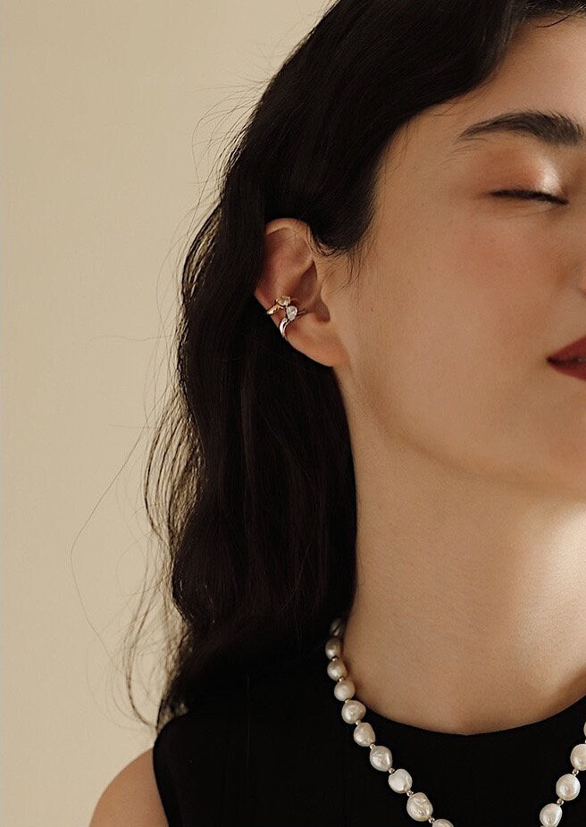 Profile shot of model wearing the Tiffany Gold Teardrop Ear Cuff