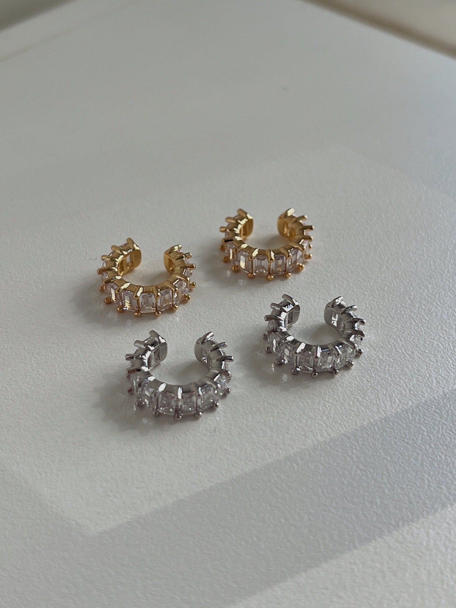 Tarnish-free 18K gold and silver cartilage cuff on a clean minimalist white background.