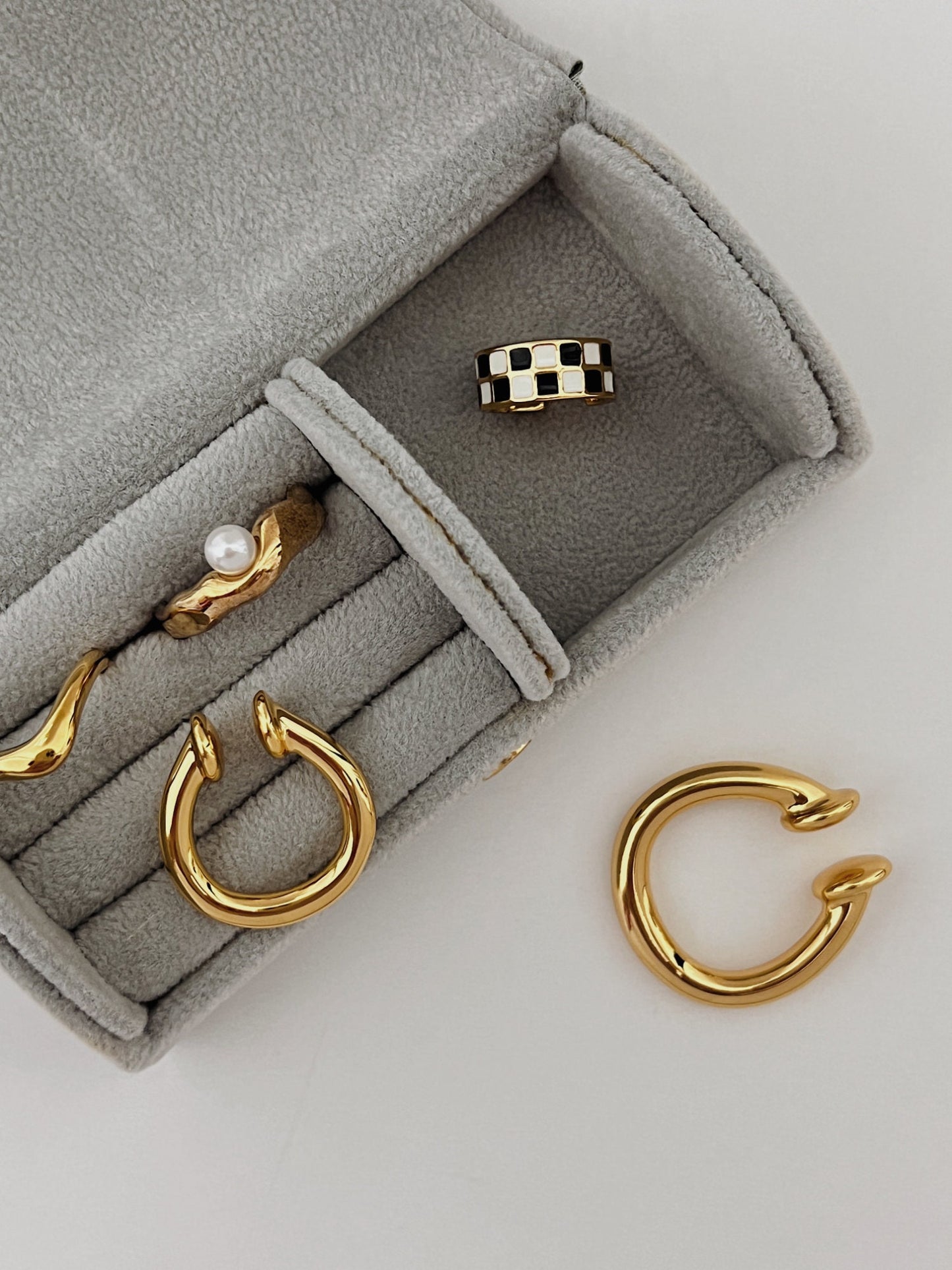 Sculptural lifestyle gold ear jewelry for bridesmaids and weddings.