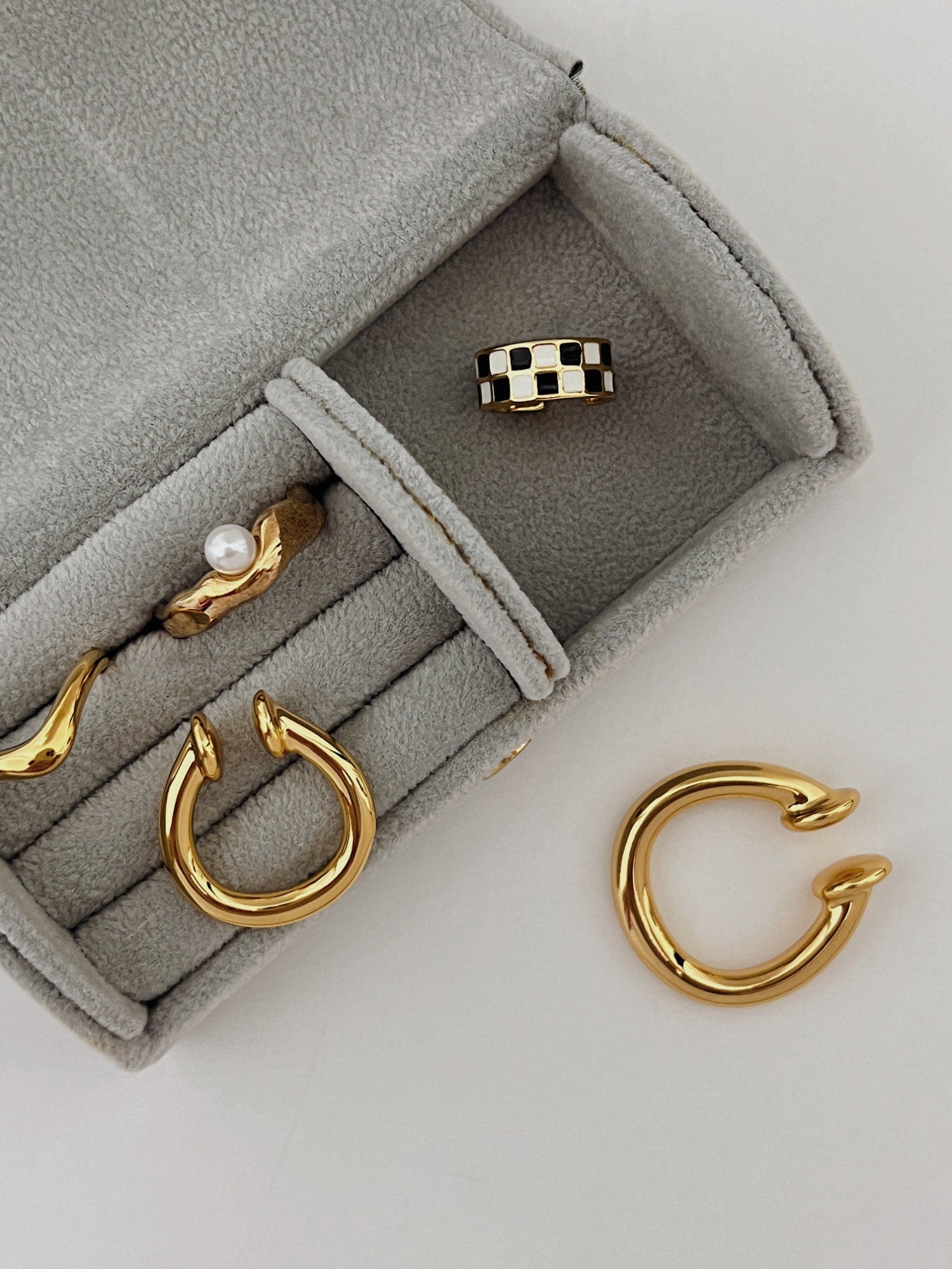 Sculptural lifestyle gold ear jewelry for bridesmaids and weddings.