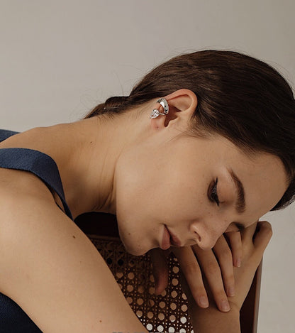 Editorial shot of non-pierced fit on model's ear cartilage.