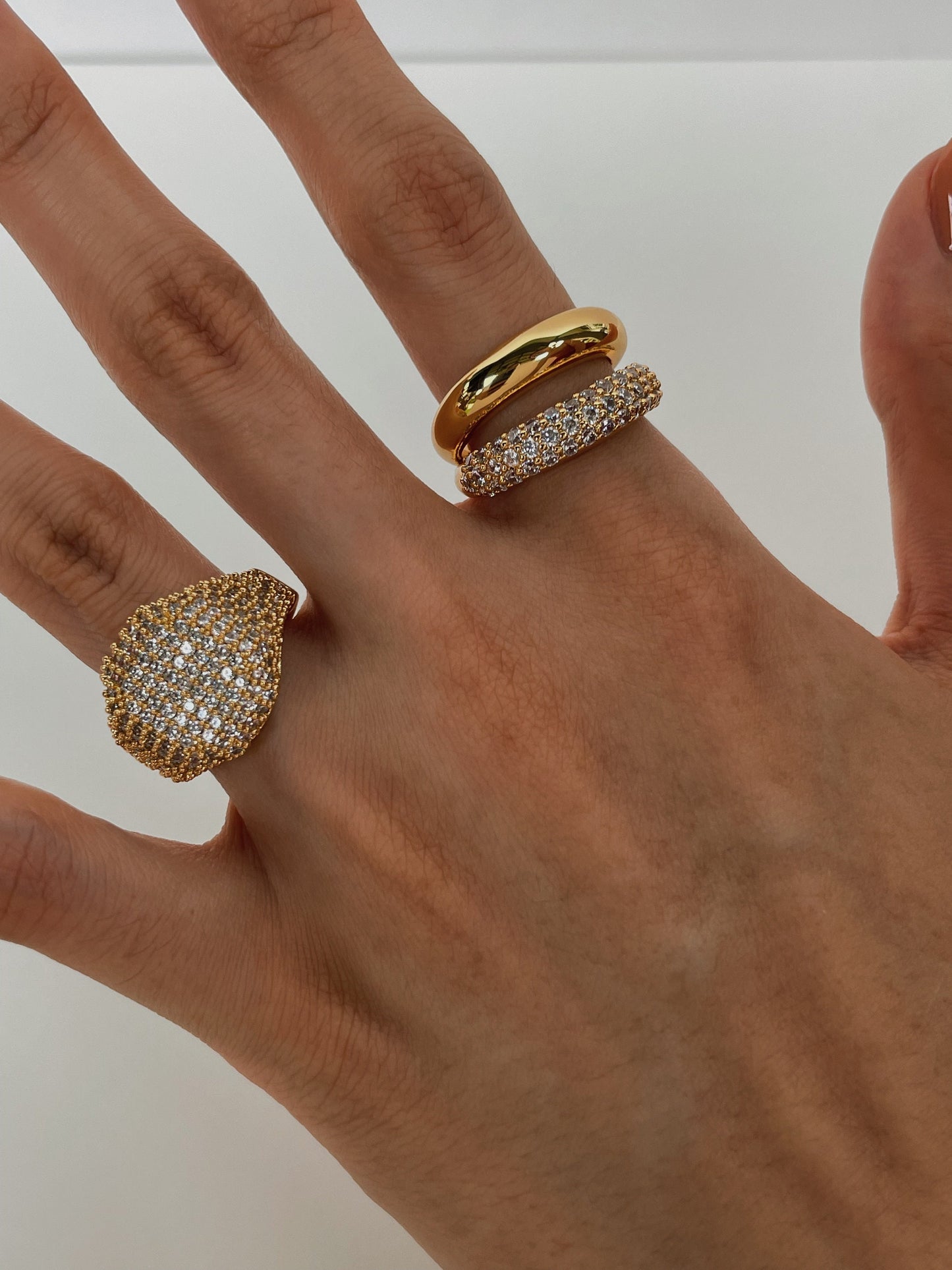 Close up of both pave statement ring gold pave jewellery