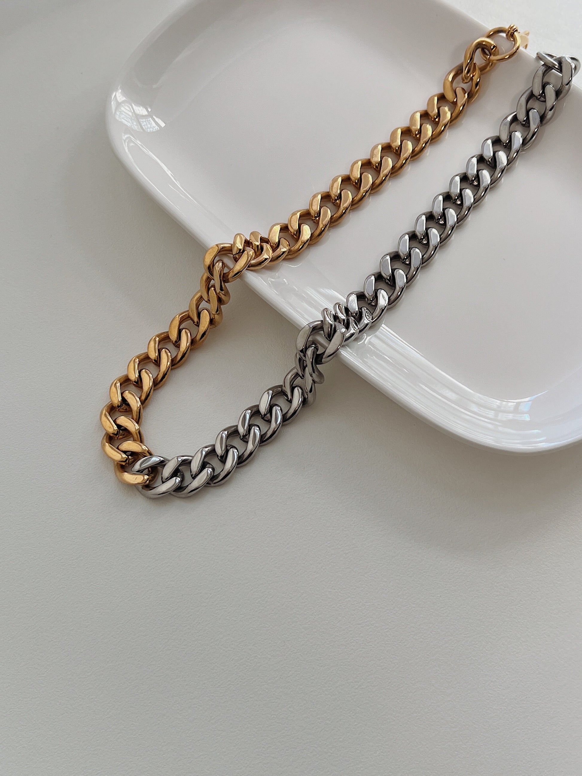 Macro perspective of independent designer structural watch style link chain detailing fluid flexibility