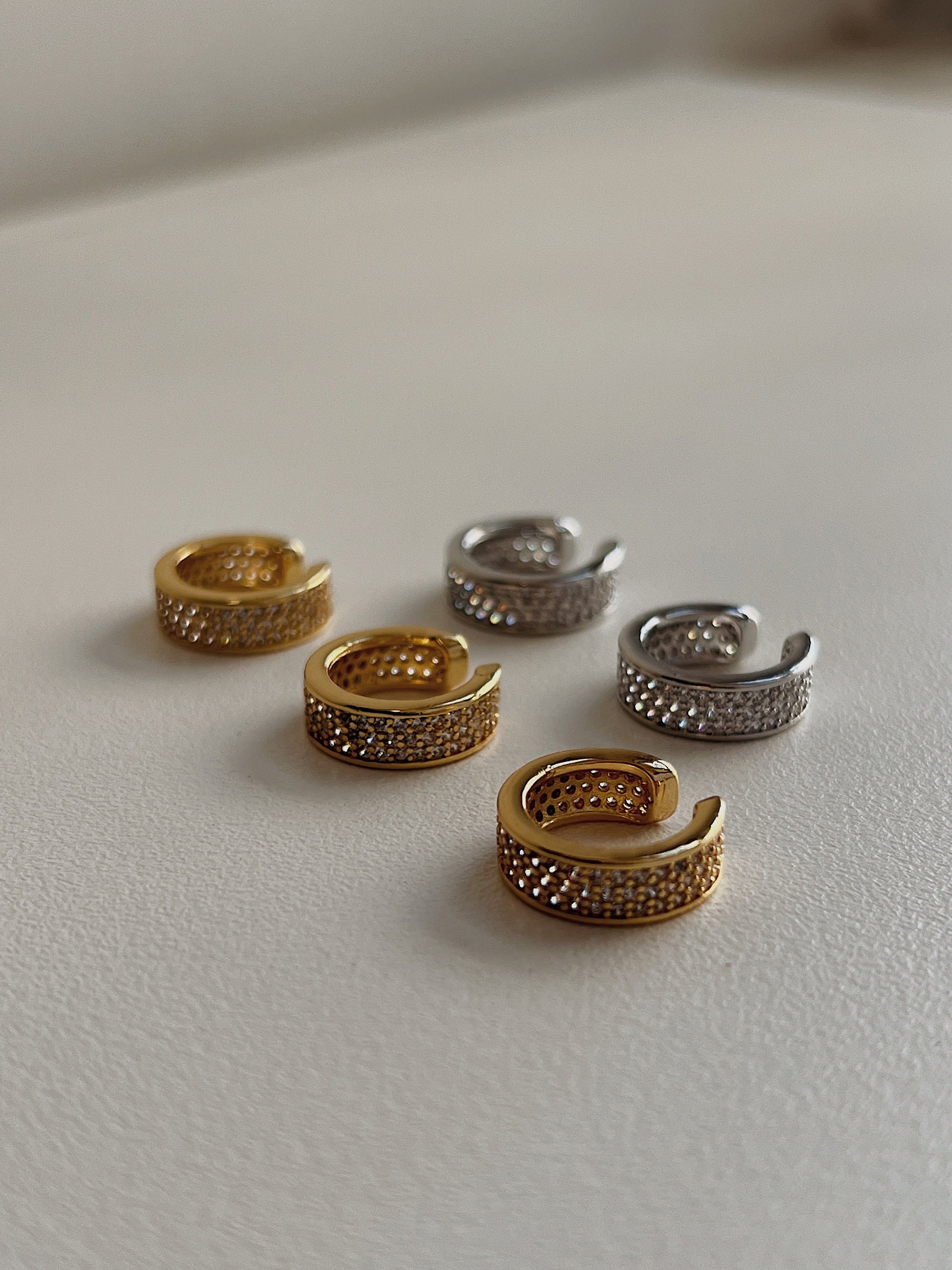 Close up of 14K gold plating and cubic zirconia texture on Priscilla cuff.