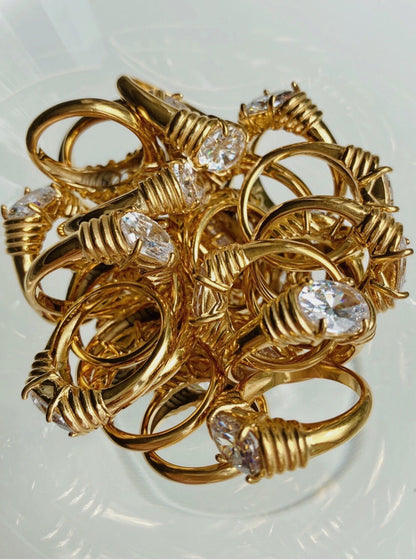 Elegant gold rings with sparkling oval diamonds, perfect for engagement or special gifts