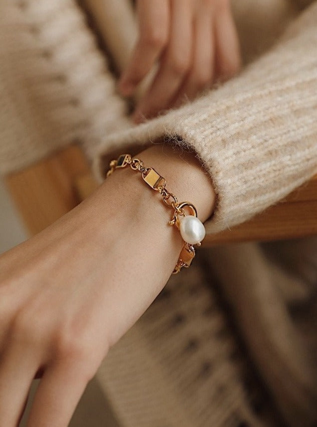 The secure, comfortable fit of the Diana gold baroque pearl bracelet shown on a wrist, highlighting its organic daily styling appeal.