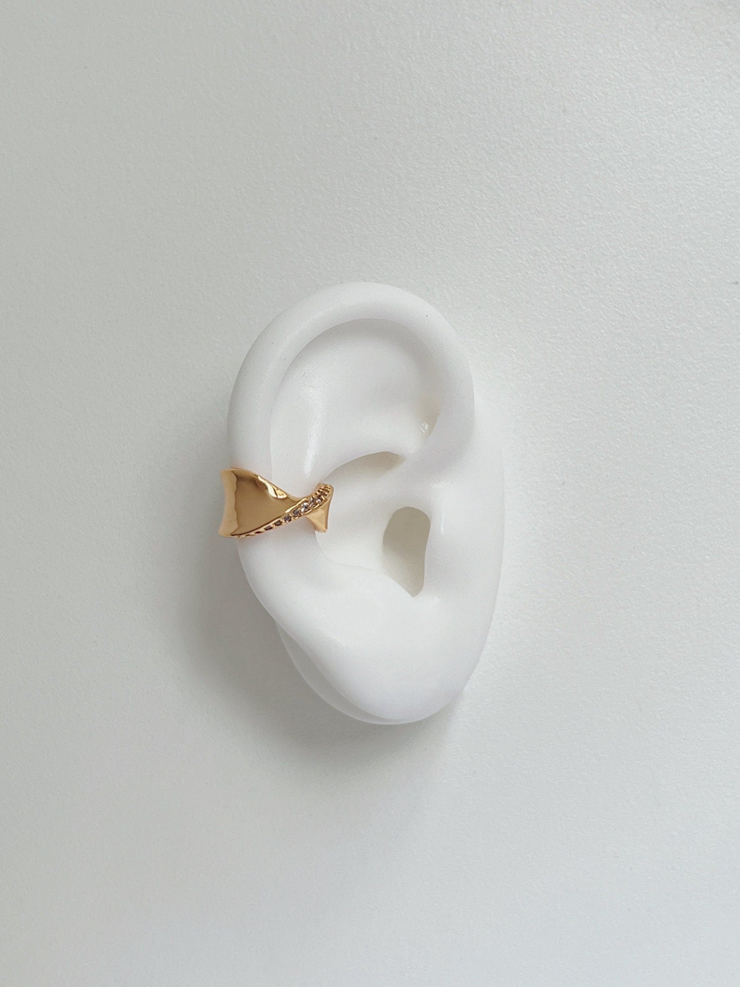 Product shot of Evelyn cuff on a silicone white ear.