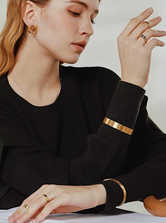 Editorial photography of gold jewellery showcasing layering look by aurous atelier