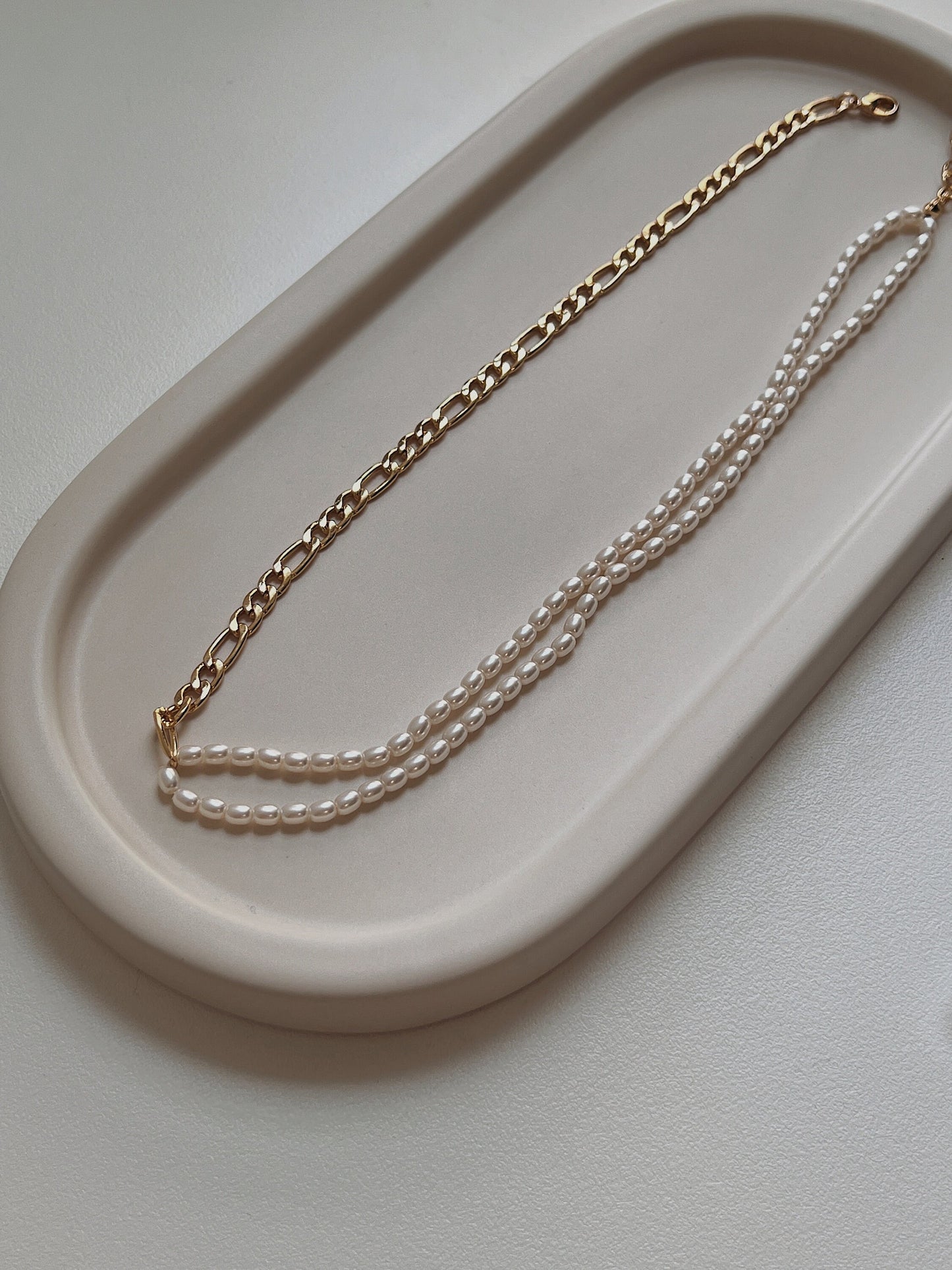 Delicate genuine freshwater seed pearls hand strung on a mixed metal statement chain