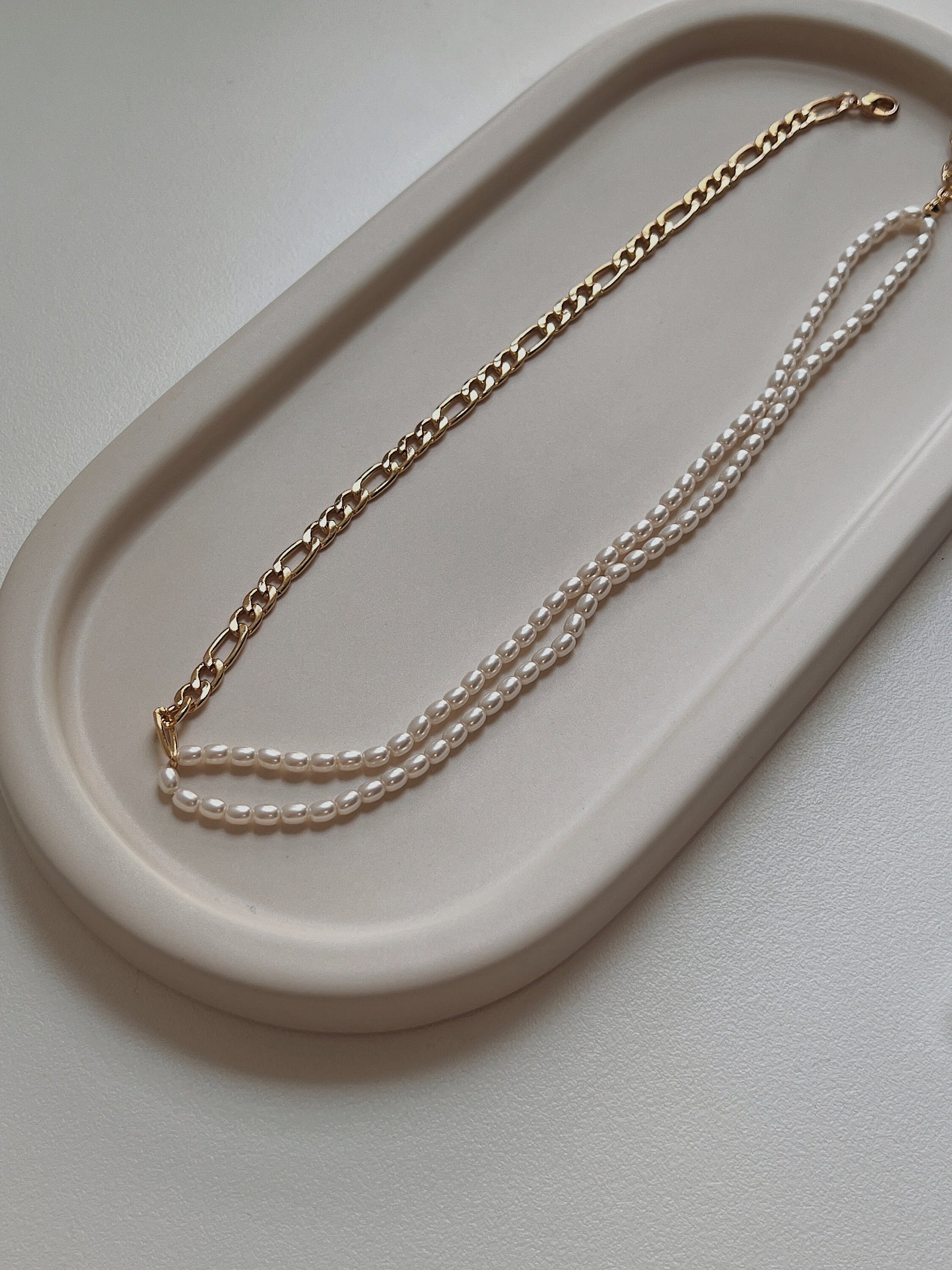 Delicate genuine freshwater seed pearls hand strung on a mixed metal statement chain