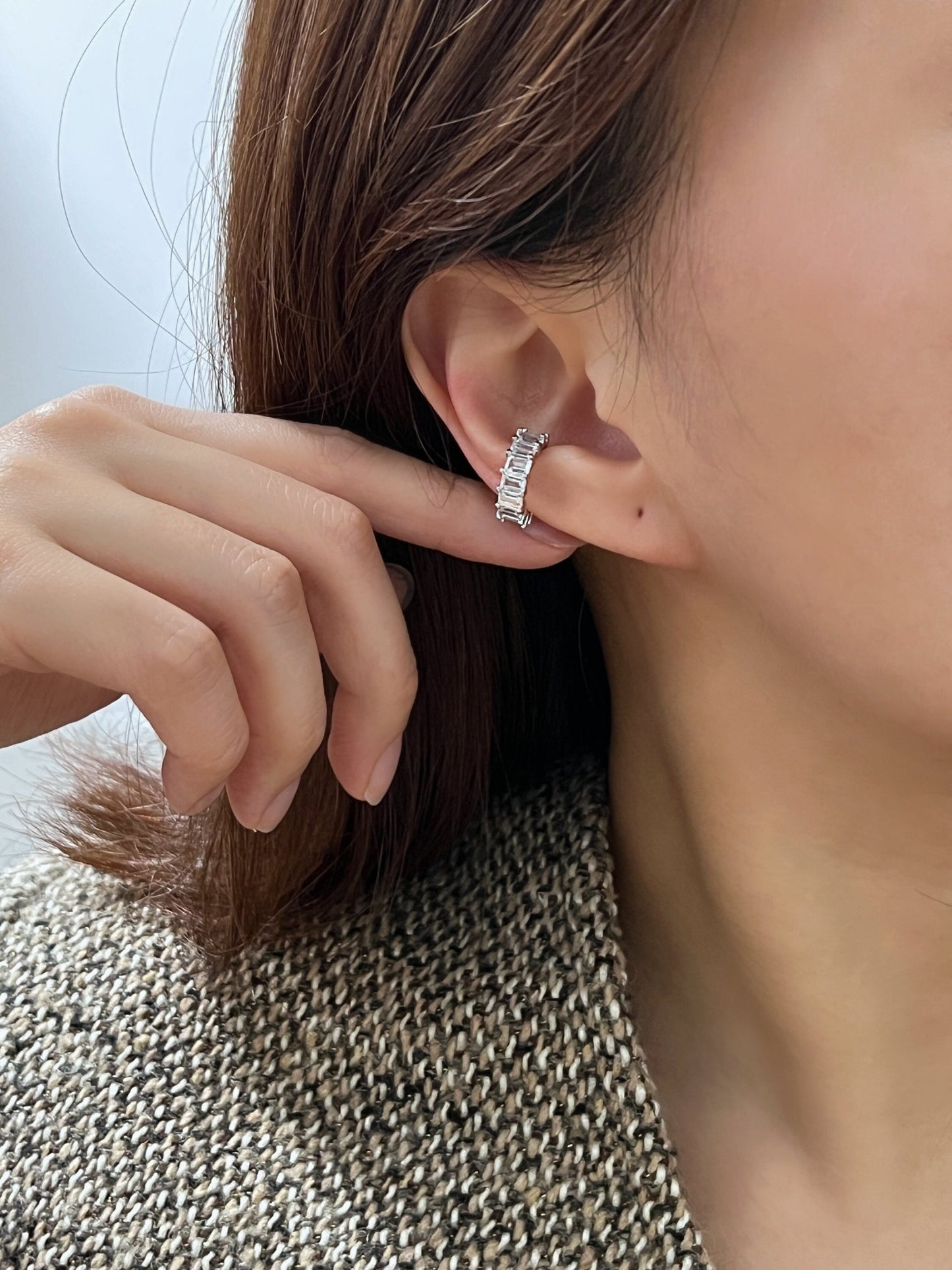 Model showcasing the brilliant shimmer of baguette stones in natural light.