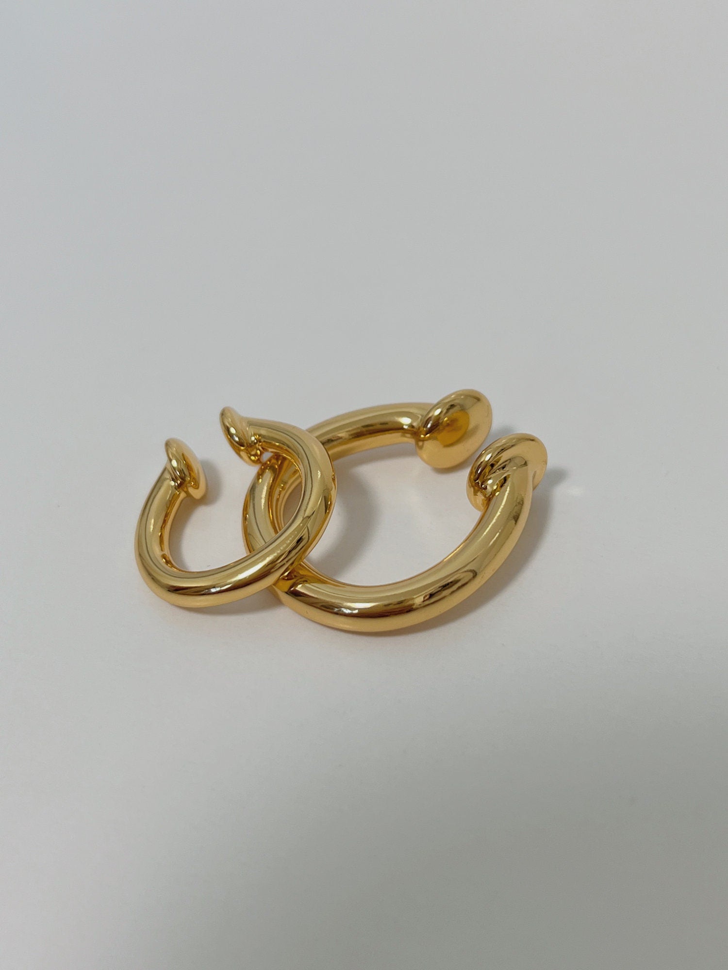 Brooklyn Hoop Cuff in 18k Gold showing ocean-friendly surgical steel base