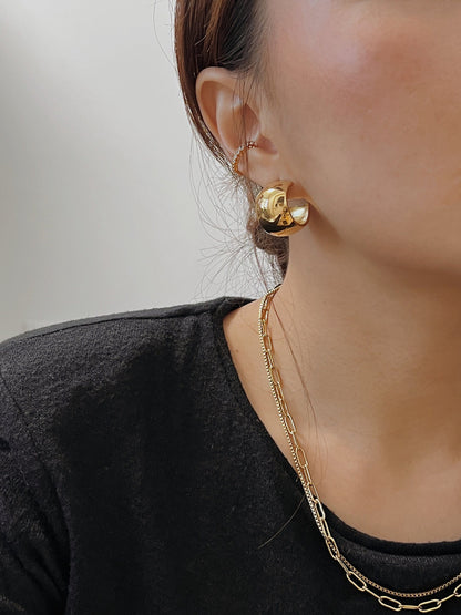 Model wearing the 1-layer Emily Gold Cuff for a clean-look stack