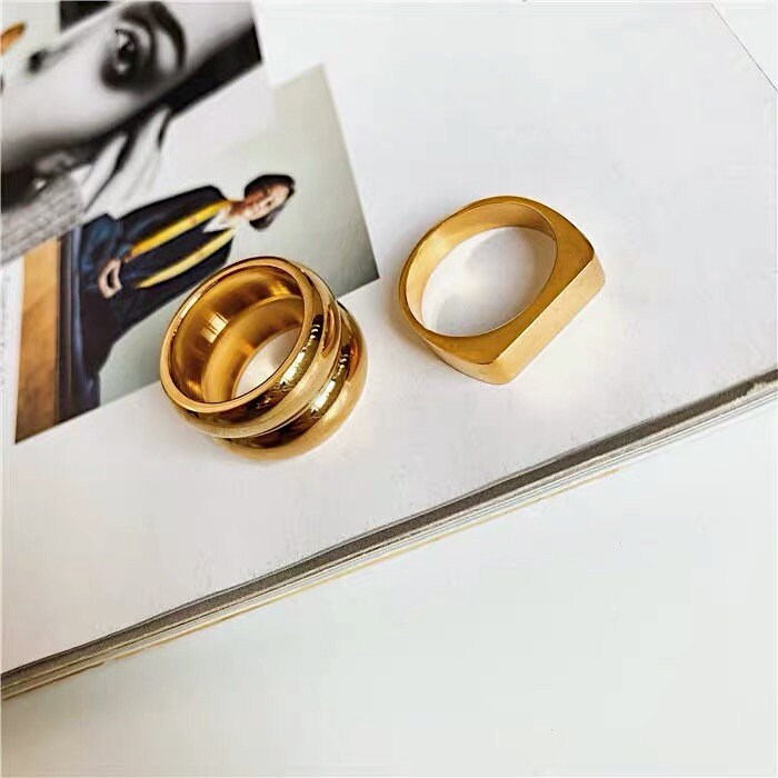Substantial weighted gold cigar band ring for high-end styling
