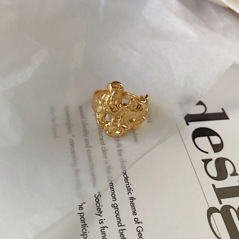Hammered yellow gold PVD ring by Aurous Atelier showing artisanal texture