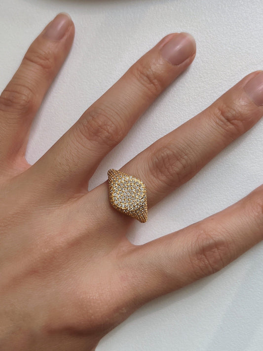 Elegant gold diamond signet ring on finger, luxury jewelry for women, sparkling design