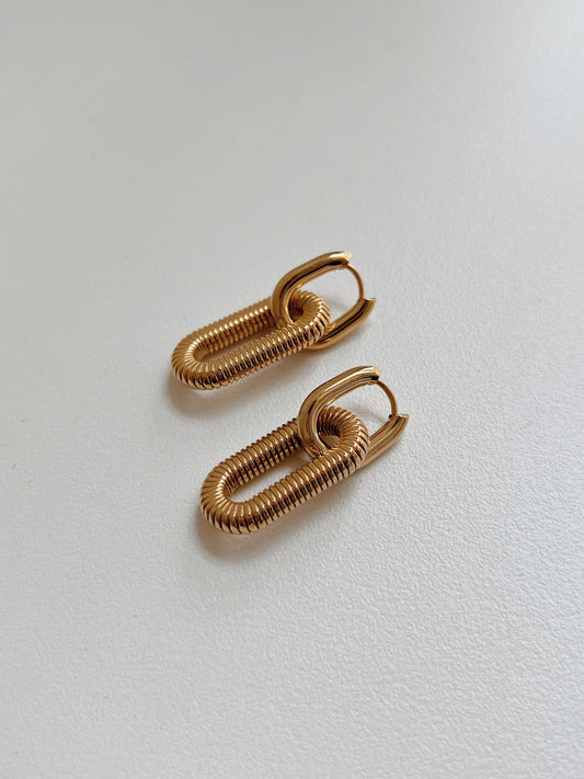 Elegant gold coil earrings, unique design, luxury jewelry for women, fashion accessories