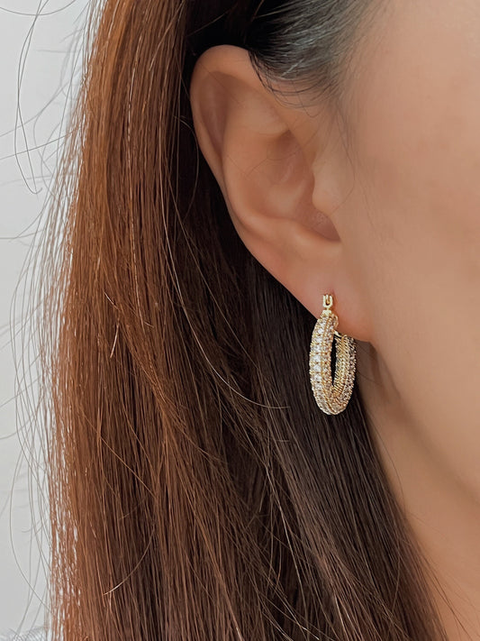 Elegant gold hoop earrings with sparkling stones, perfect for special occasions.