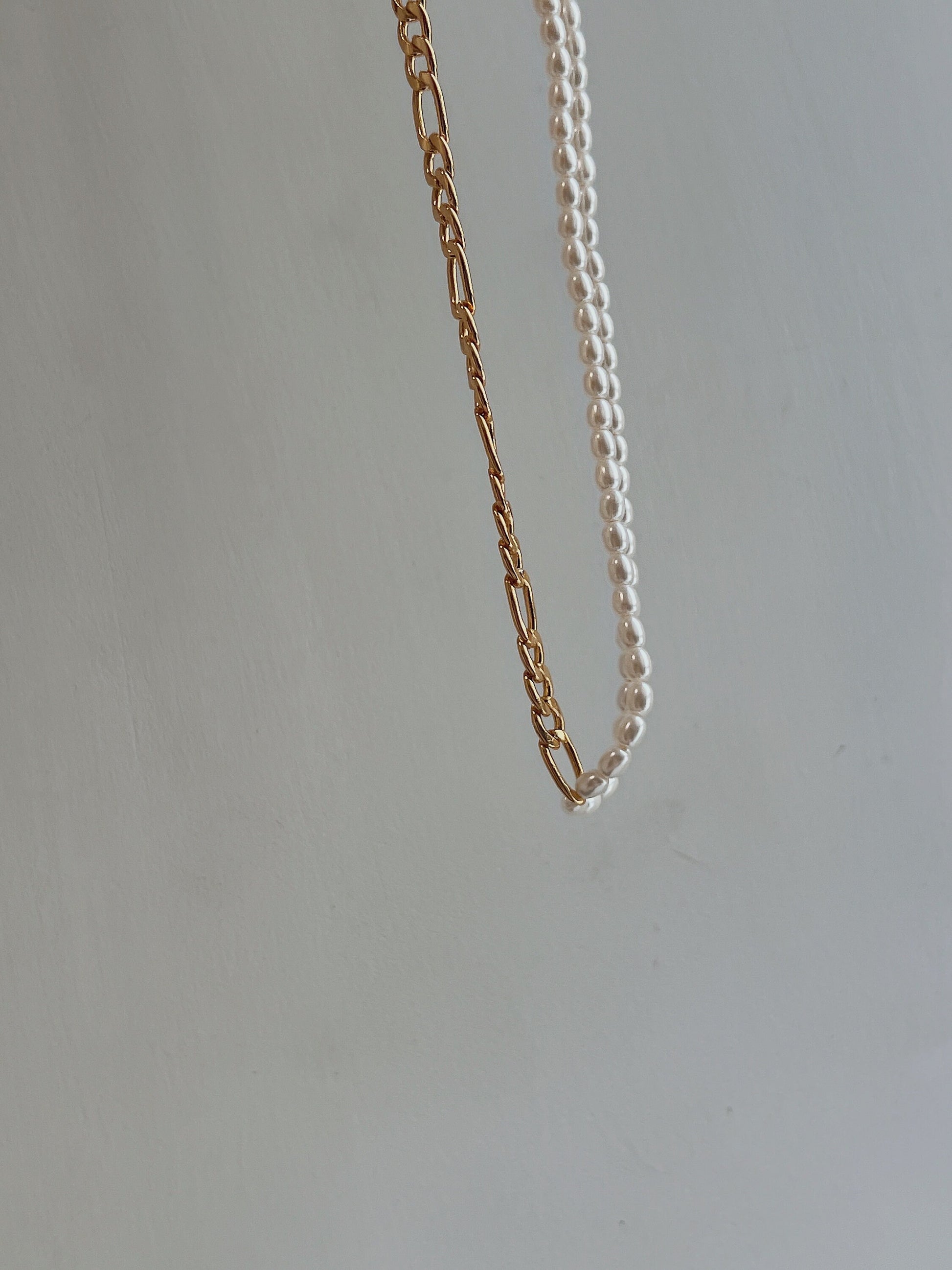 Hypoallergenic brass core daily statement necklace displayed under natural lighting