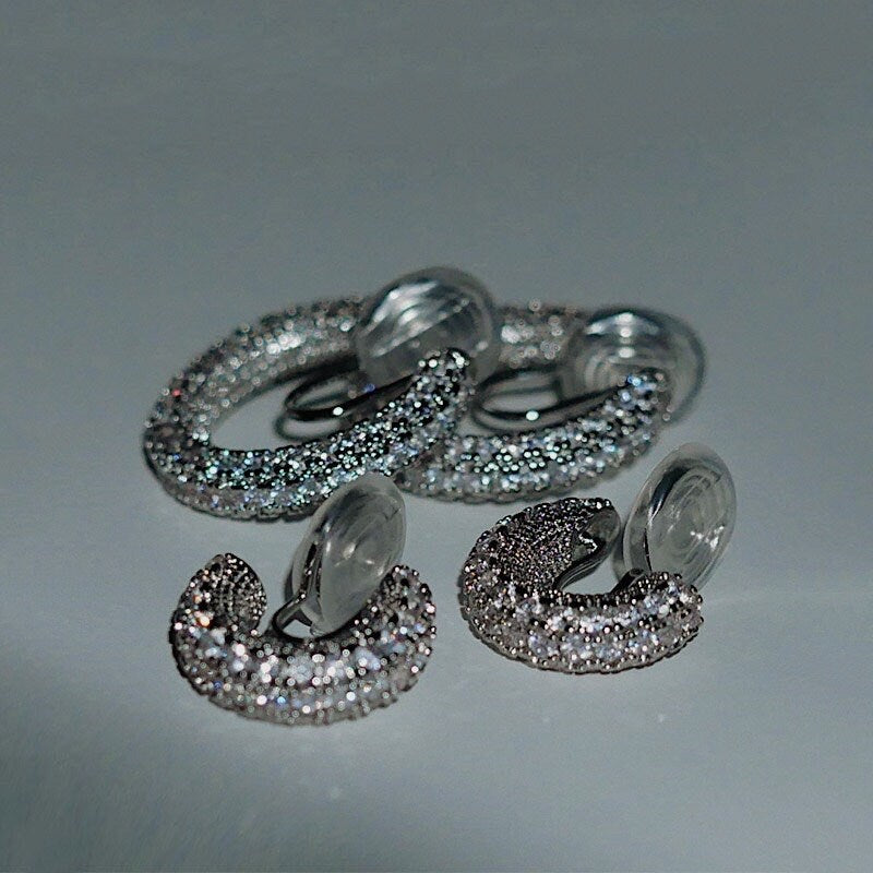 Size comparison between Small 15mm and Medium 22mm Jayne pavé CZ clip-on hoop earrings