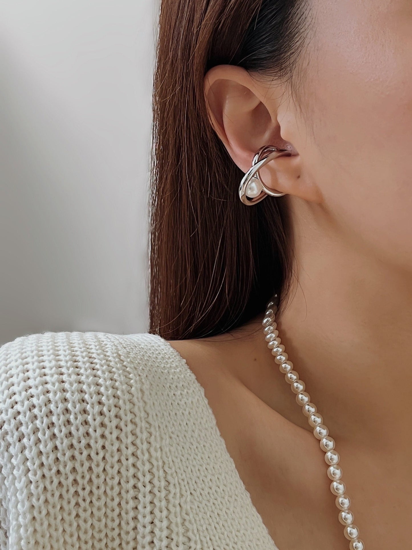 Model wearing silver Karolina Pearl Cuff for an asymmetrical look
