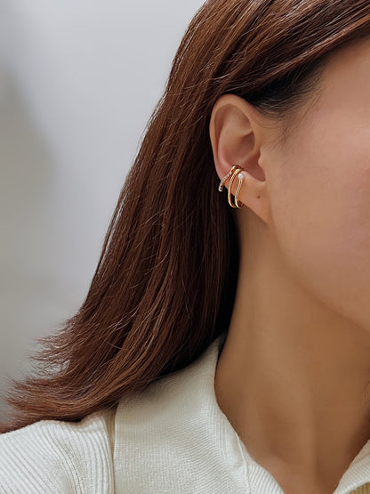 Model showcasing Heidi cuff with white sweater.