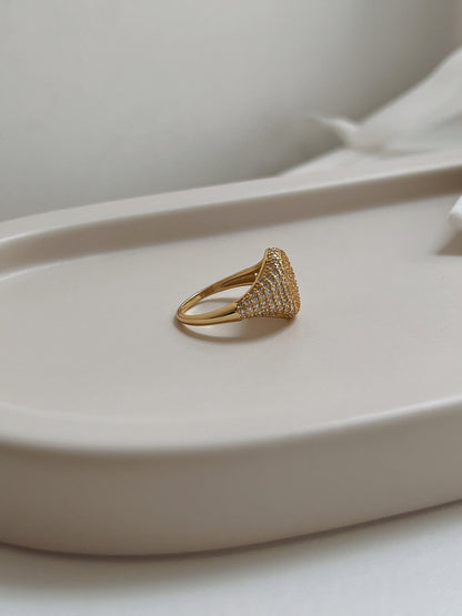 Side profile of sculptural 18k gold vermeil signet band.