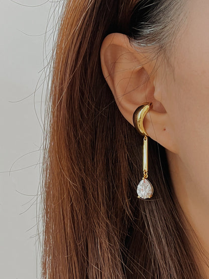 Model with slicked hair showcasing tear drop design
