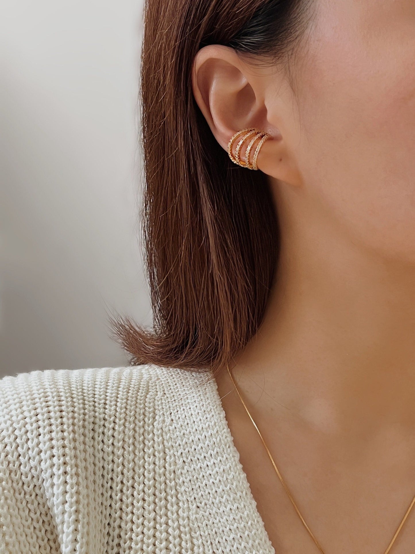 Model wearing Aurelia pavé ear cuff on helix.