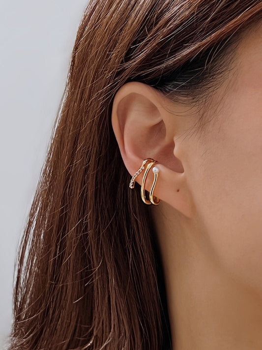 Model wearing Heidi pearl cuff on helix.