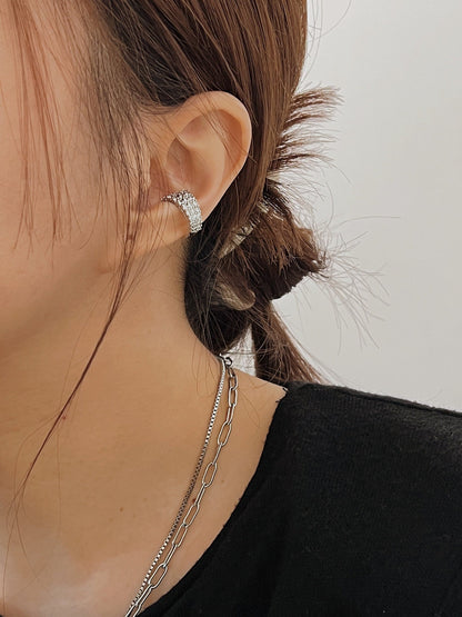 Close-up of model's ear showing the secure fit of the Emily cuff