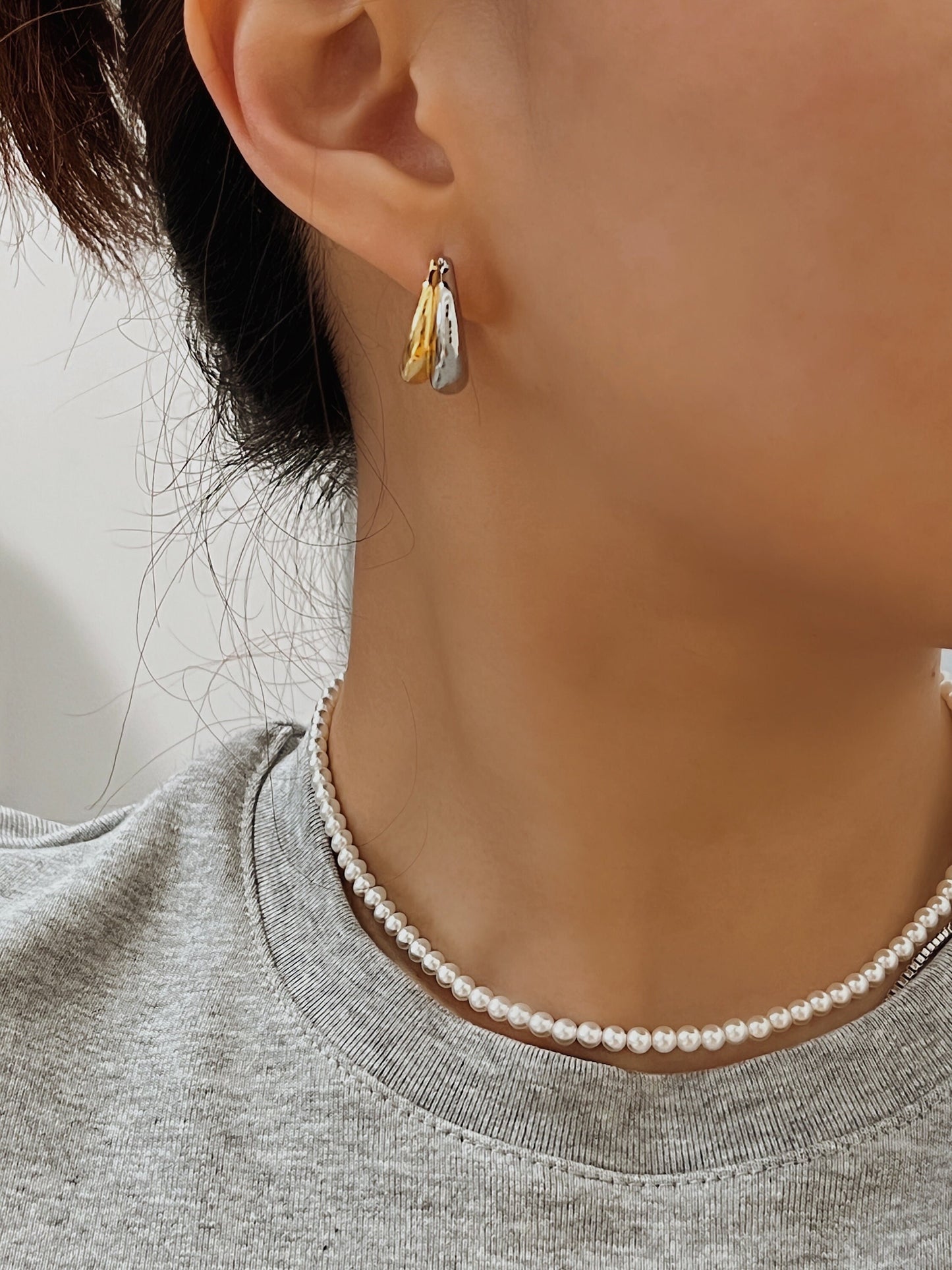 Model collarbone perspective styling the marianna tiny pearl choker with heather grey top