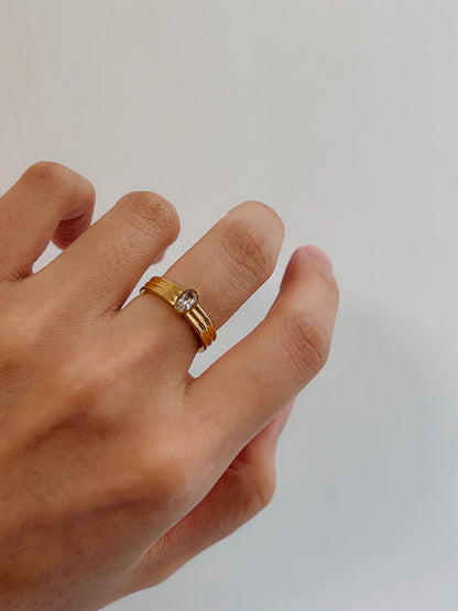 Aurous Atelier Poppi ring on hand model for an architectural aesthetic