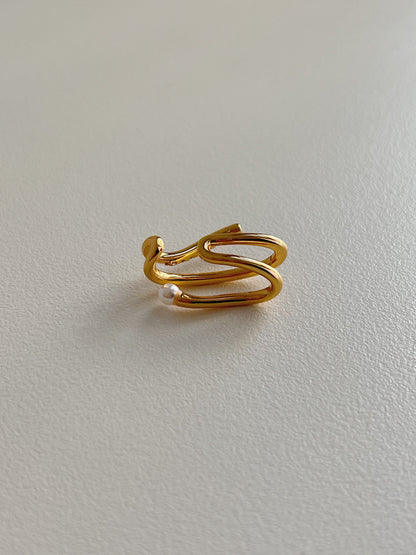 Top-down view of Heidi waterproof pearl ear cuff.