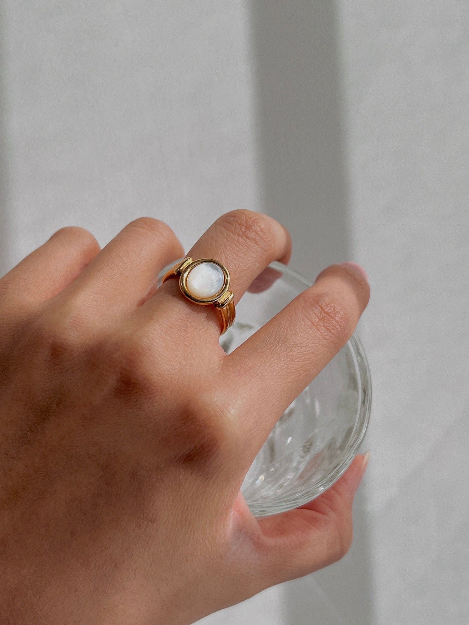Modern luxury gold signet ring with genuine iridescent pearl center