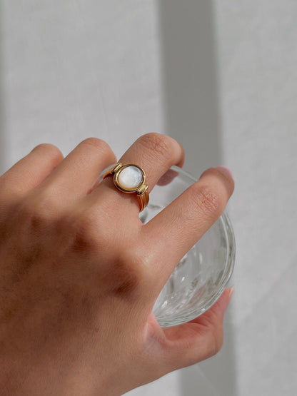 Modern luxury gold signet ring with genuine iridescent pearl center