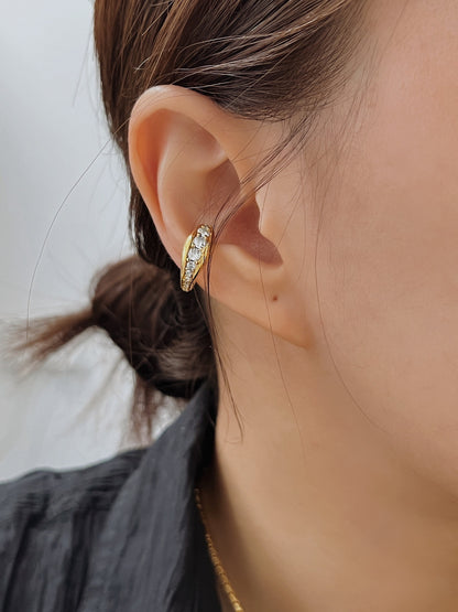 Close-up of ear stack styling with Marissa gold cuff.