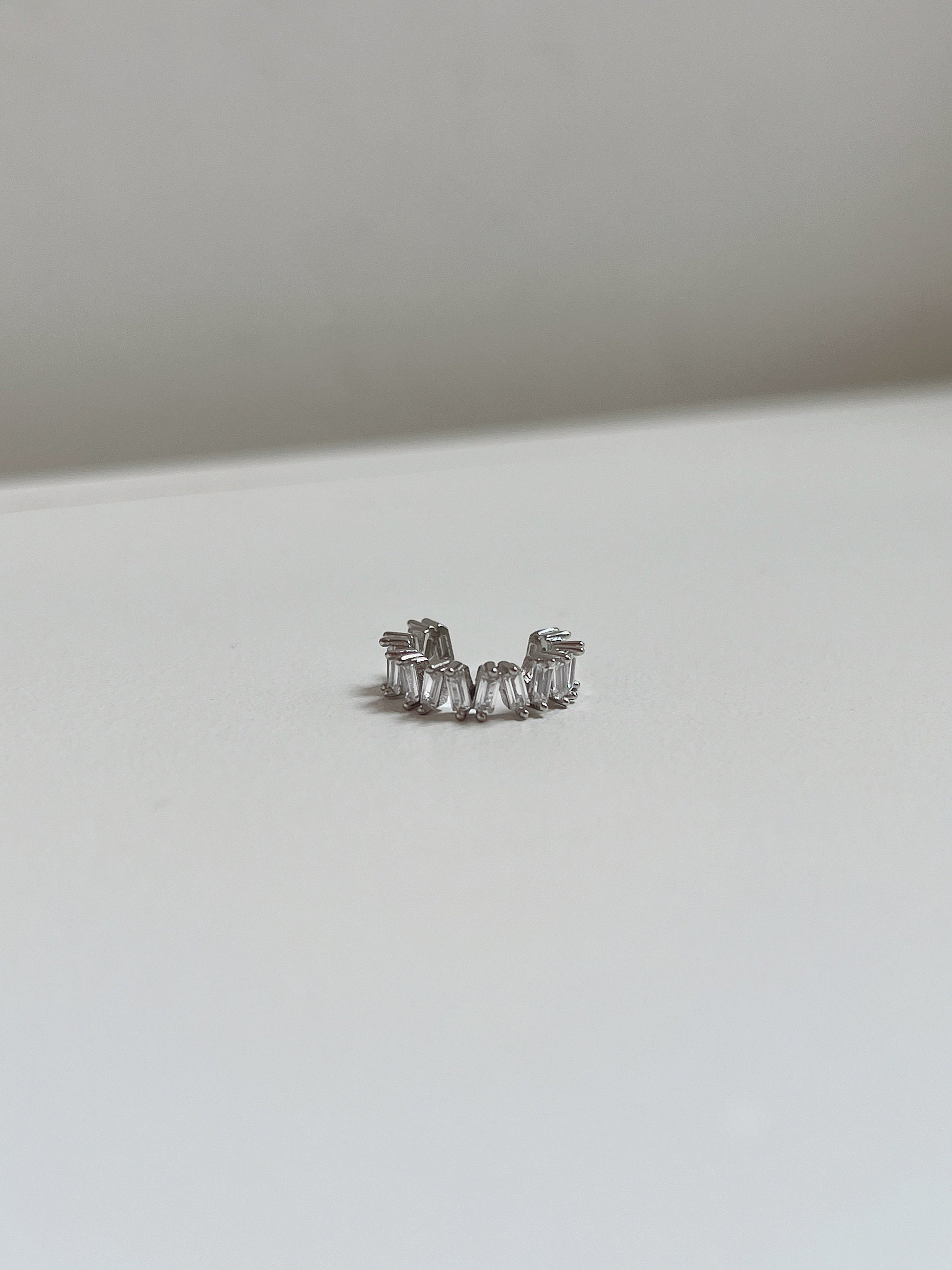 Front view of geometric silver baguette ear cuff.