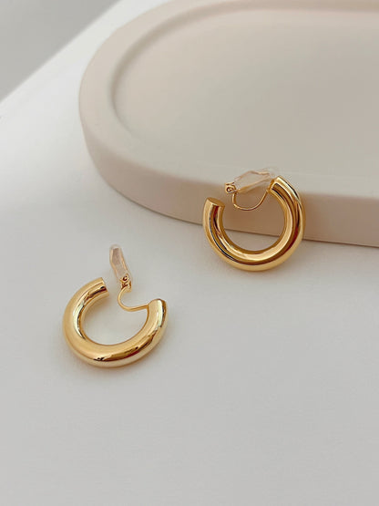 High shine 18k gold pvd thick tube hoop earrings built for modern capsule closet rotations