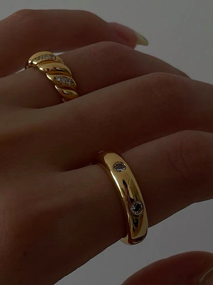 Model wearing the Carlota gold dome ring for a power lunch styling