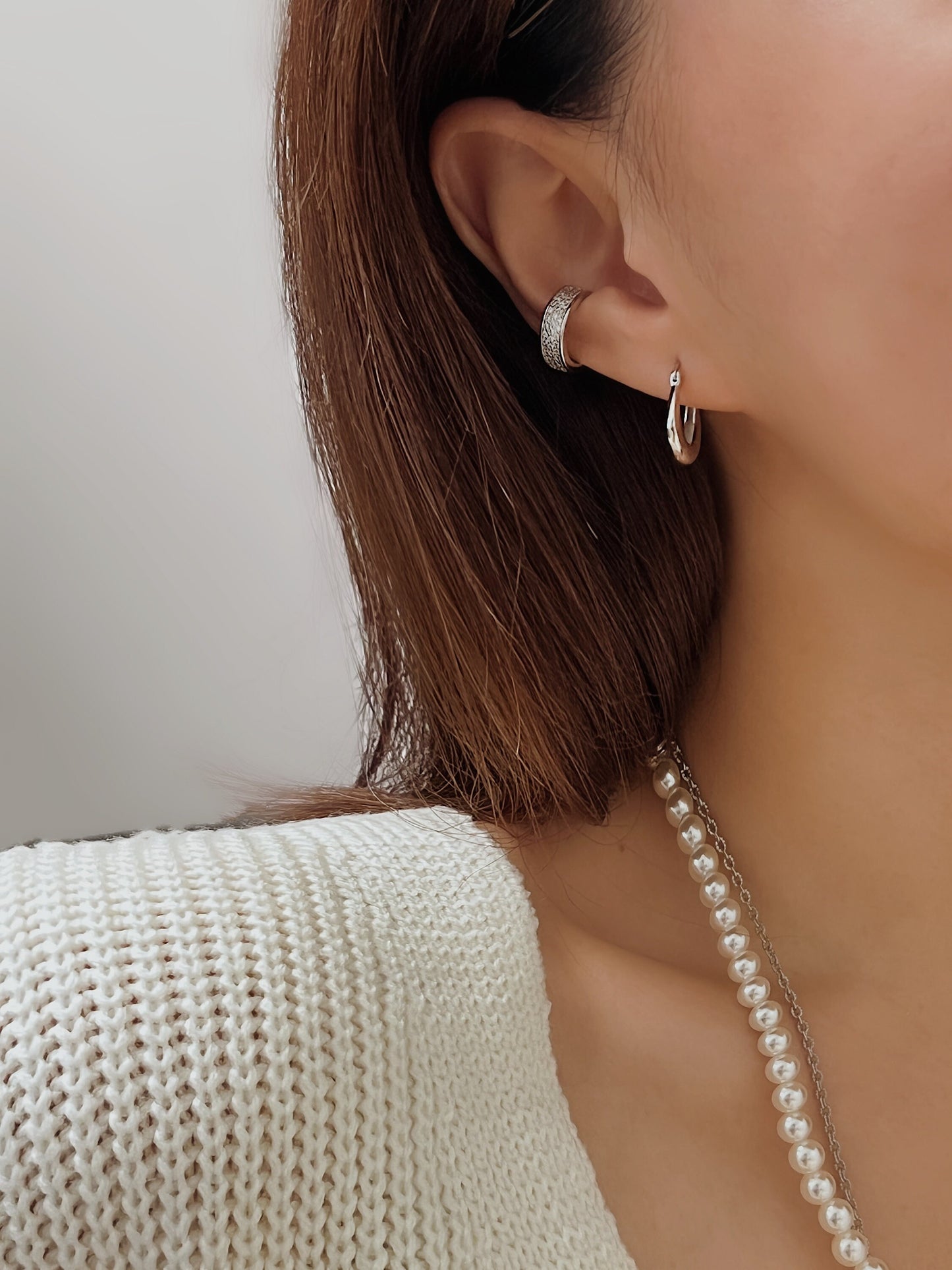 Side profile of model showing mid-ear placement of Pave Cuff.