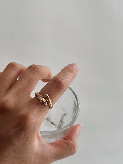 Aurous Atelier Doris ring on hand model for a quiet luxury aesthetic
